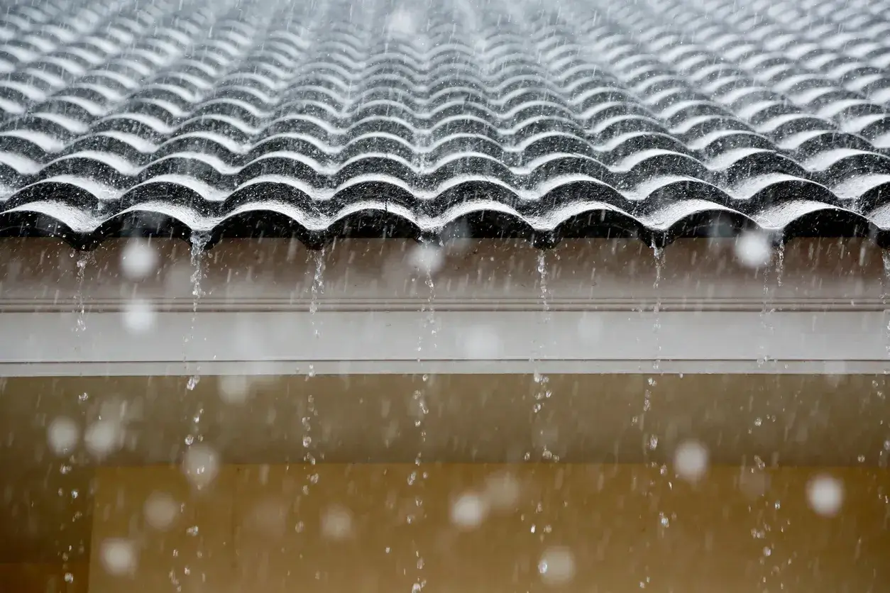 rain falling water on a roof